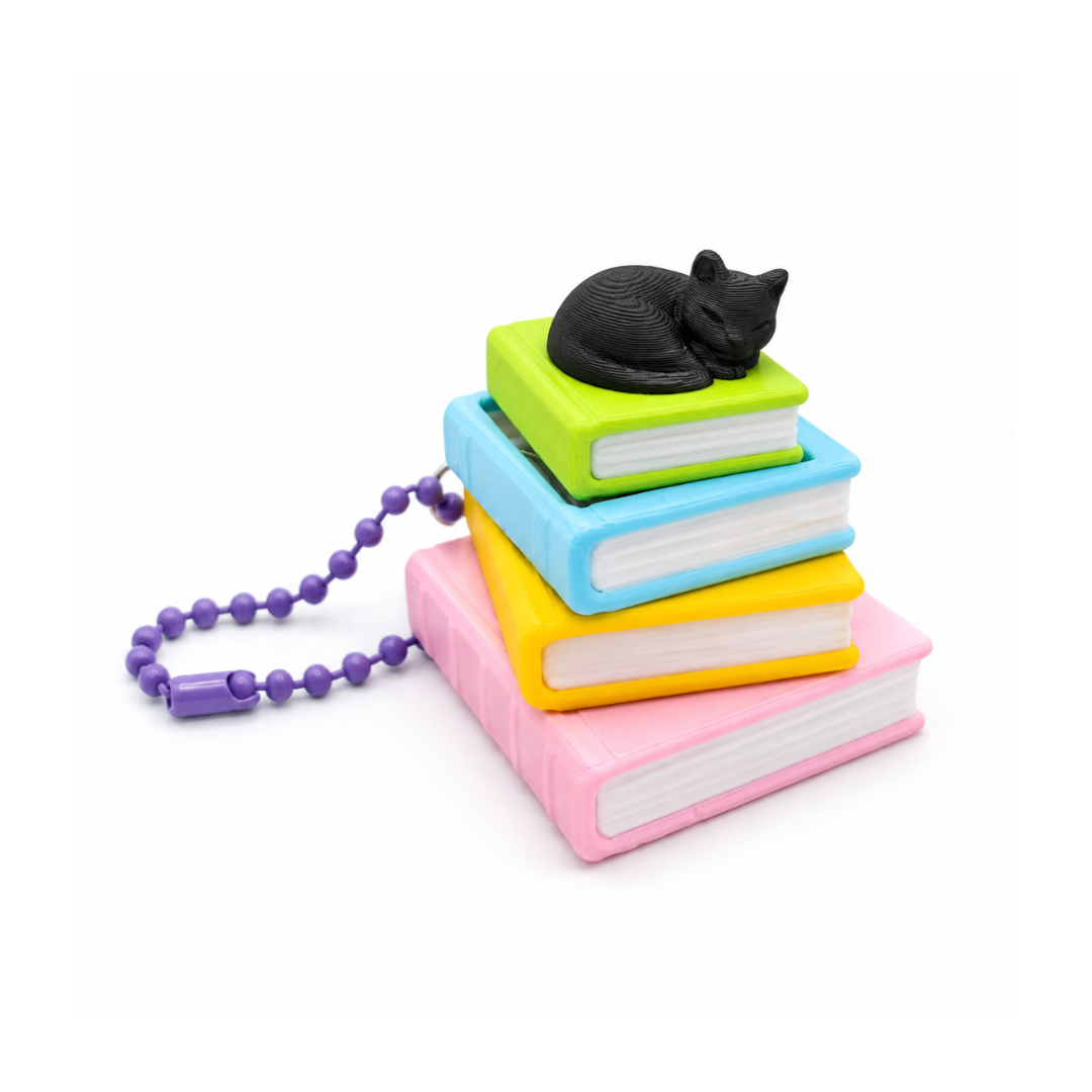 Llavero clicker de libros con gatito