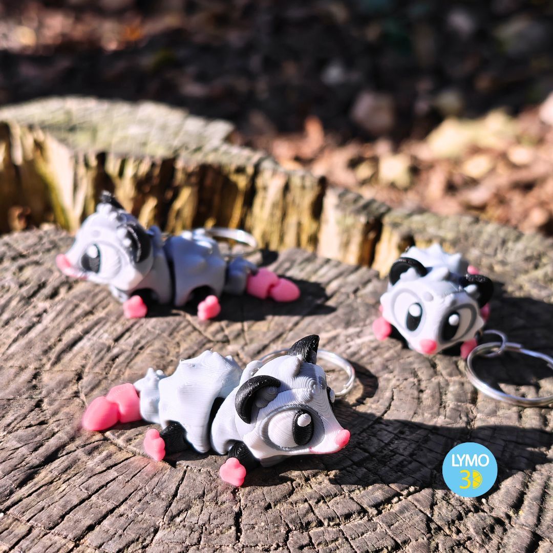 Schlüsselanhänger mit beweglichem Opossum