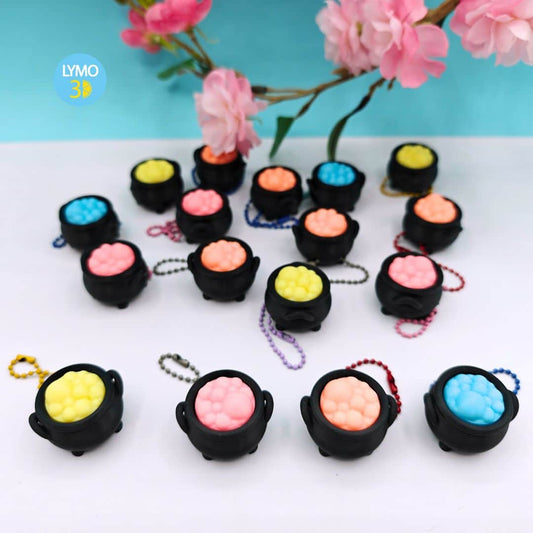 Llavero clicker caldero mágico