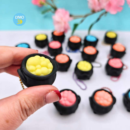 Llavero clicker caldero mágico