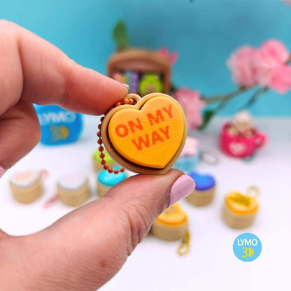 Llavero clicker corazón con texto