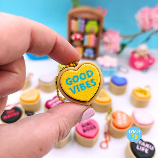 Llavero clicker corazón con texto