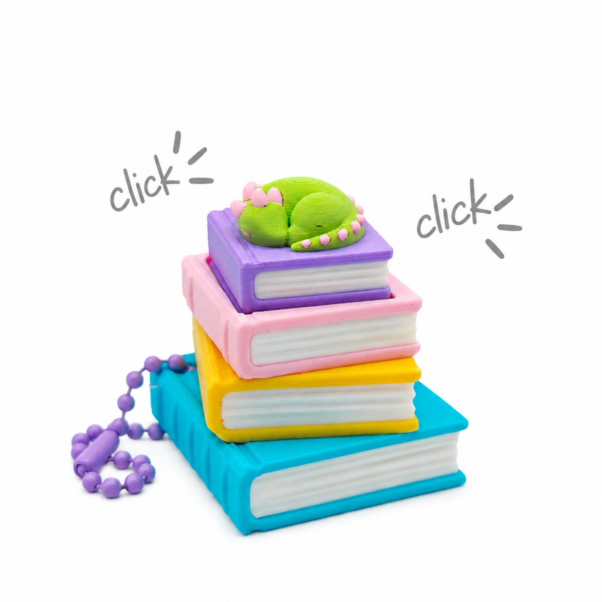 Llavero clicker de libros con dragoncito