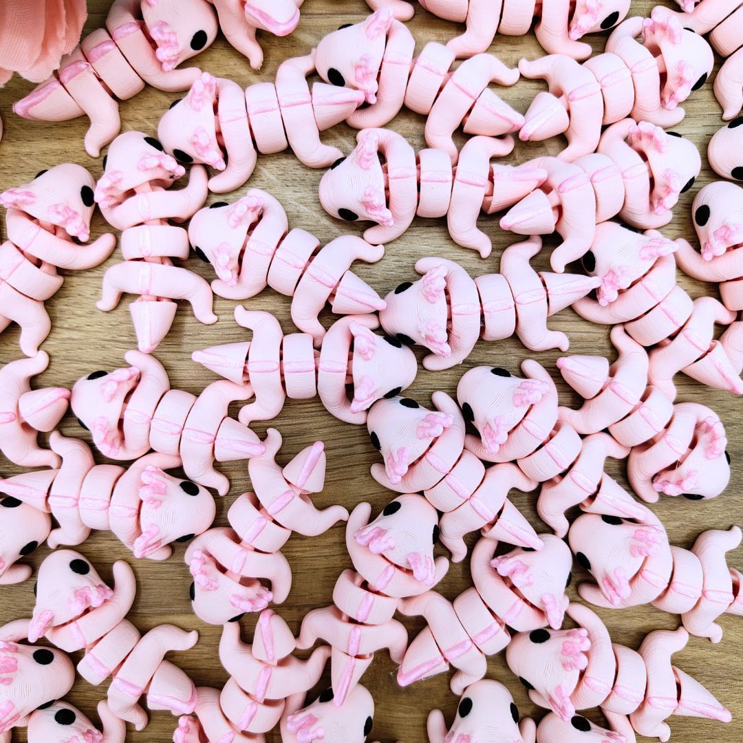 Mini ajolote rosa articulado