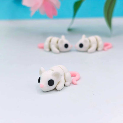 Mini articulated white rat
