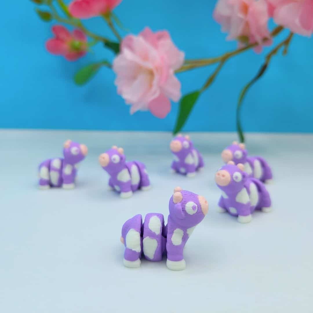 Mini purple articulated cow