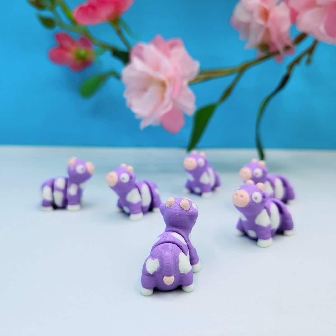 Mini purple articulated cow