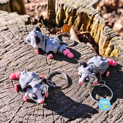 Schlüsselanhänger mit beweglichem Opossum