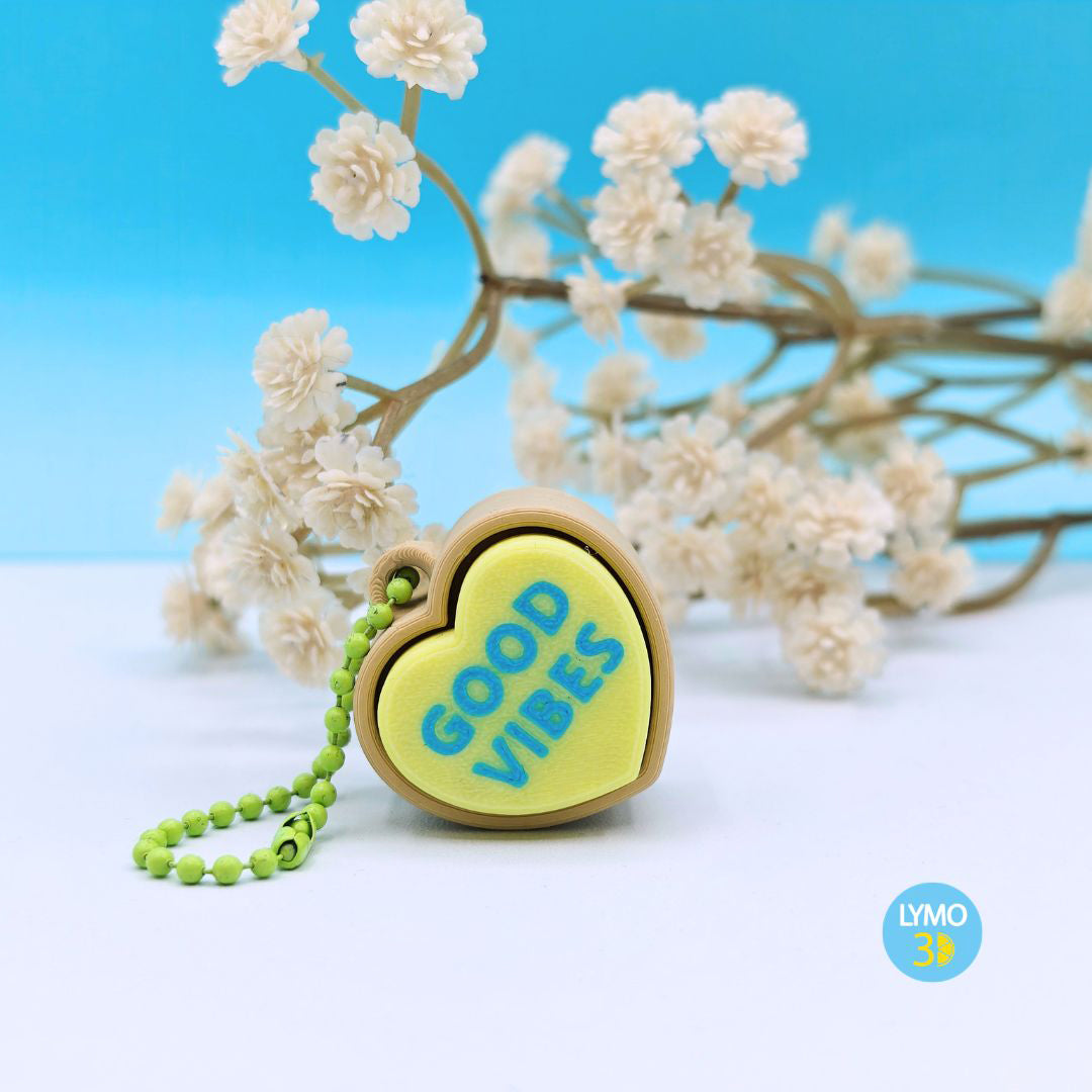 Llavero clicker corazón con texto