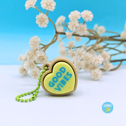 Llavero clicker corazón con texto